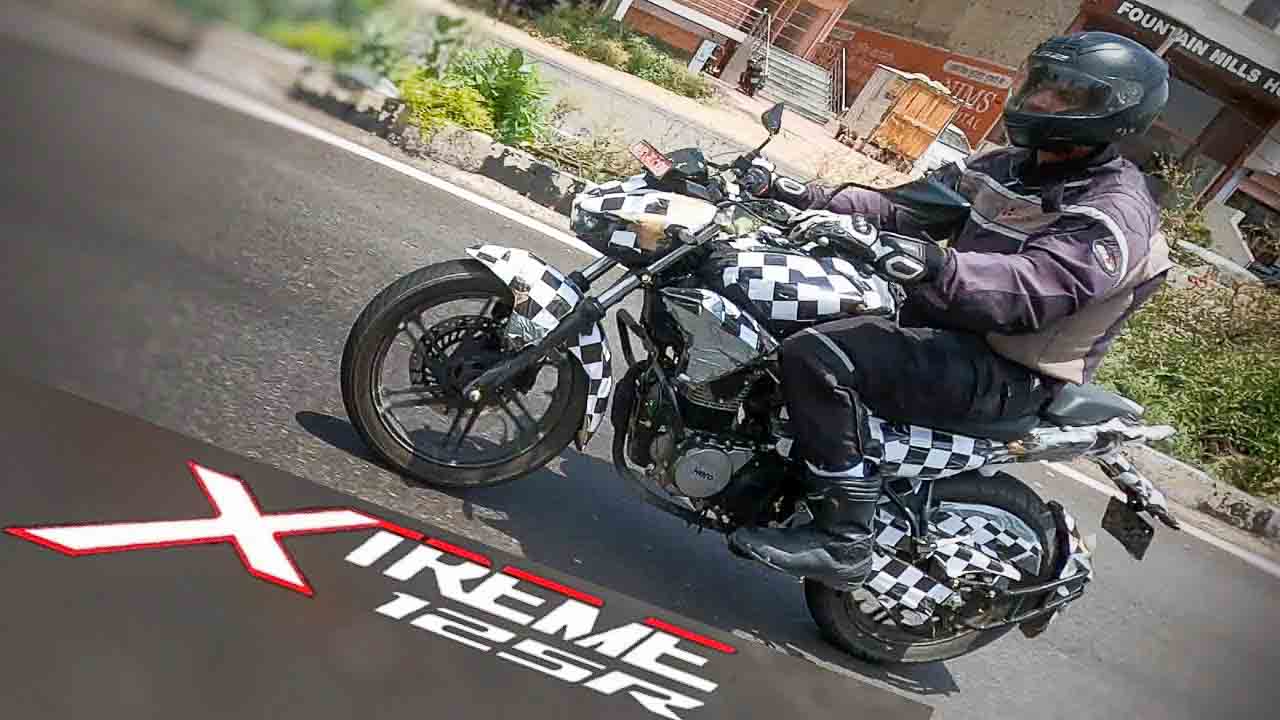 Hero motorcycle being ridden on a road